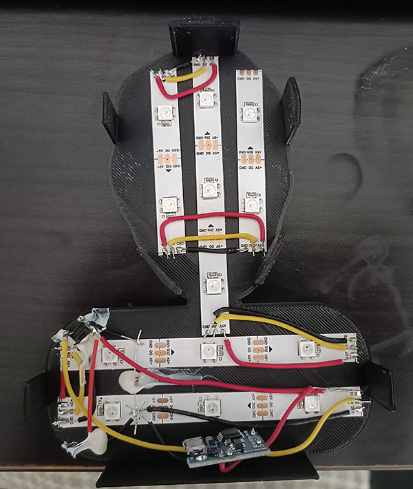 A naked Electric Friend Face The backplate of an Electric Friend Face showing the LED strips and electronics